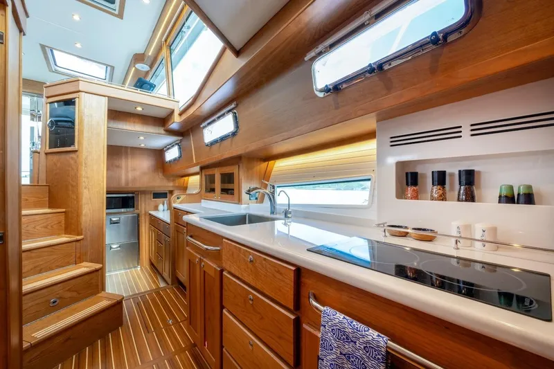  Yacht Photos Pics Luxurious interior of 2027 Sabre 51 Salon Express yacht with modern kitchen design.