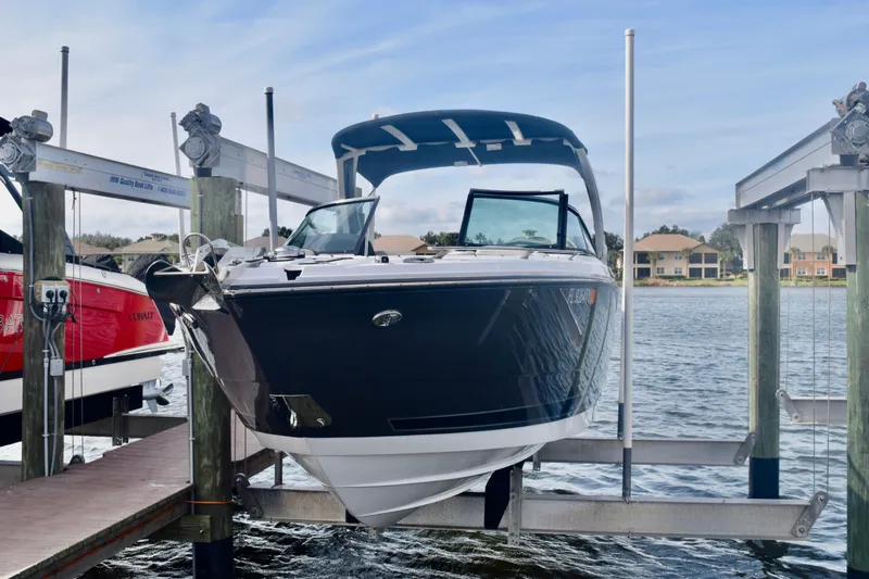  Yacht Photos Pics 2025 Monterey 275SS Super Sport boat on lift at marina dock.