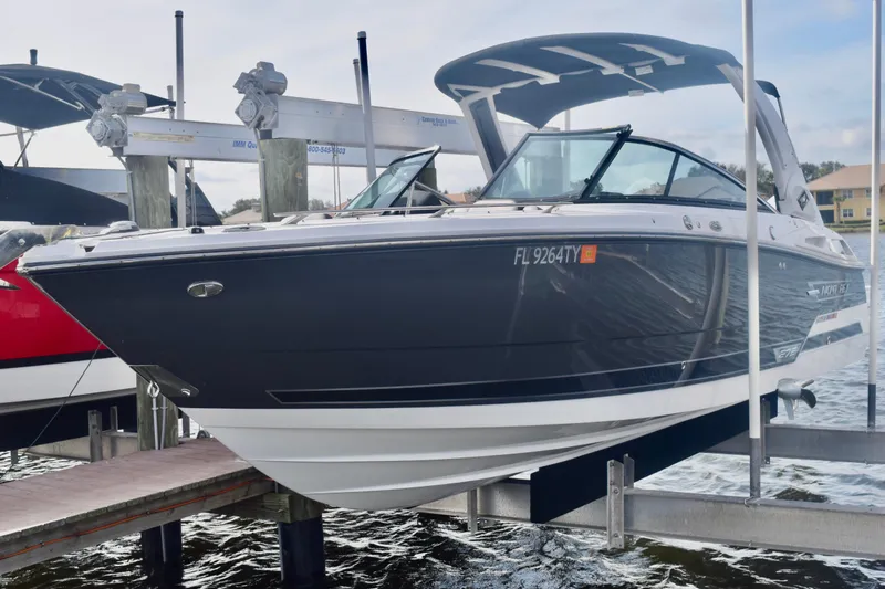  Yacht Photos Pics 2025 Monterey 275SS Super Sport boat docked on a lift, side view.