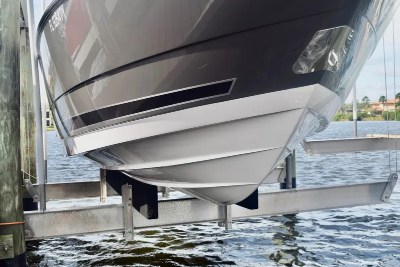  Yacht Photos Pics 2025 Monterey 275SS Super Sport boat hull on lift by water.