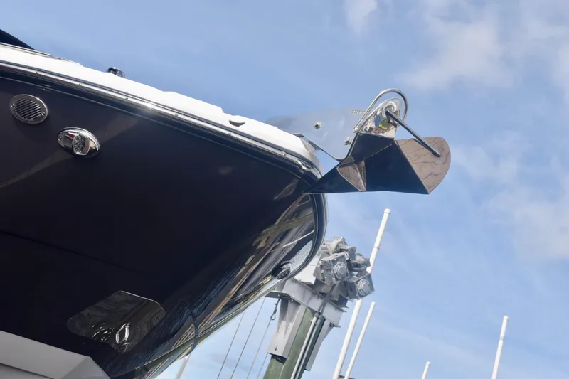  Yacht Photos Pics 2025 Monterey 275SS Super Sport boat bow with anchor against blue sky.