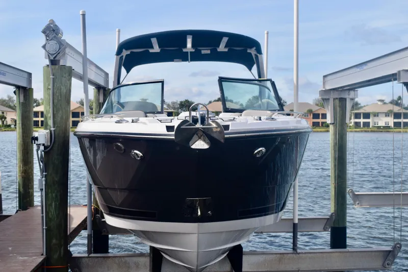  Yacht Photos Pics 2025 Monterey 275SS Super Sport boat docked on a lift by the water.