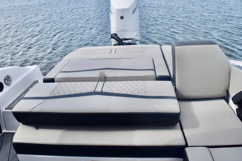  Yacht Photos Pics 2025 Monterey 275SS Super Sport boat with luxurious seating on calm water.