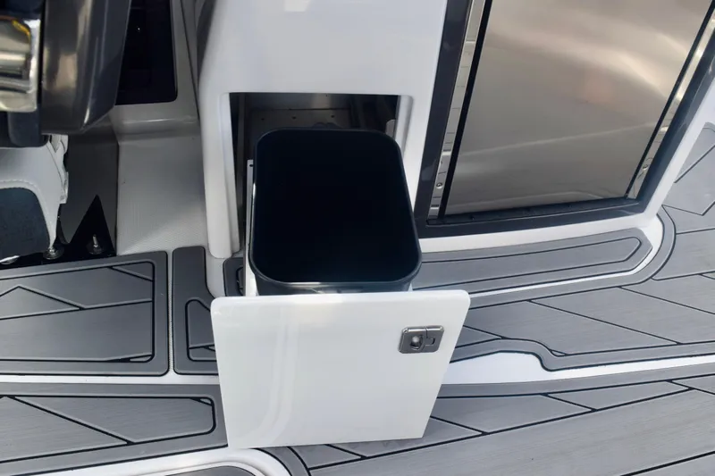  Yacht Photos Pics 2025 Monterey 275SS Super Sport boat interior with open storage compartment and sleek flooring.