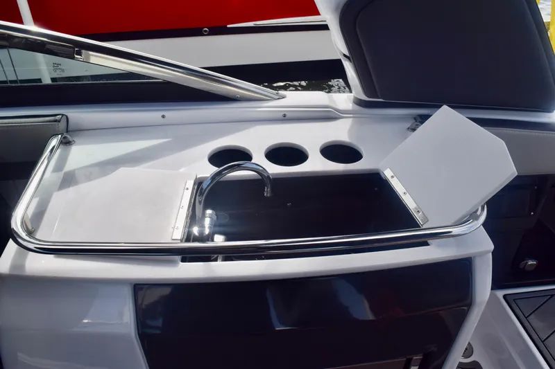  Yacht Photos Pics 2025 Monterey 275SS Super Sport boat interior with sleek sink and cup holders.