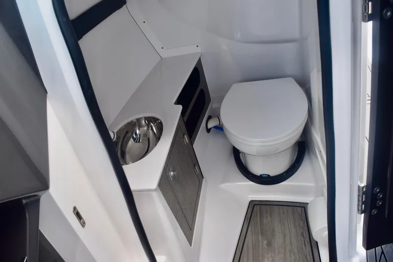  Yacht Photos Pics 2025 Monterey 275SS Super Sport boat interior bathroom with toilet and sink.