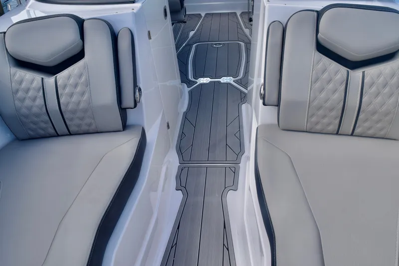  Yacht Photos Pics 2025 Monterey 275SS Super Sport boat interior with luxurious seating and sleek flooring design.