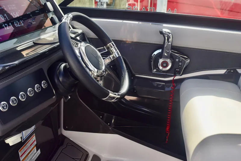  Yacht Photos Pics 2025 Monterey 275SS Super Sport boat cockpit with steering wheel and control panel.