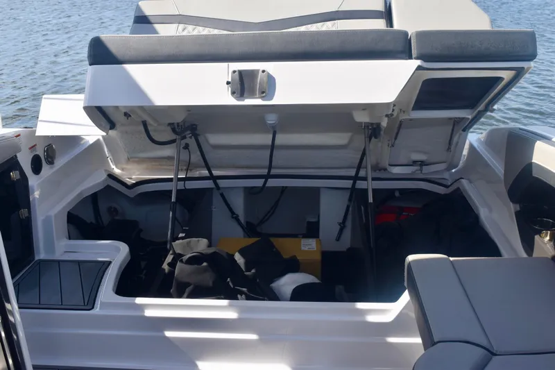  Yacht Photos Pics Open storage compartment on 2025 Monterey 275SS Super Sport boat, revealing interior space.