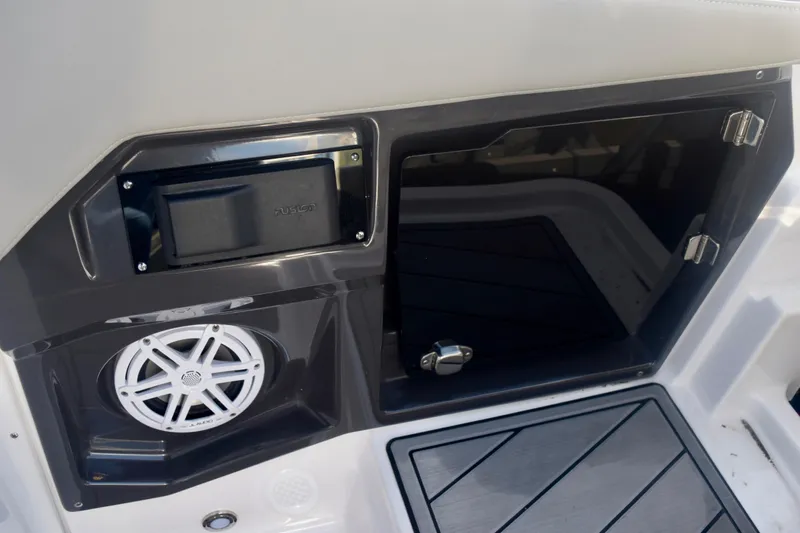  Yacht Photos Pics 2025 Monterey 275SS Super Sport boat interior with speaker and storage compartment.