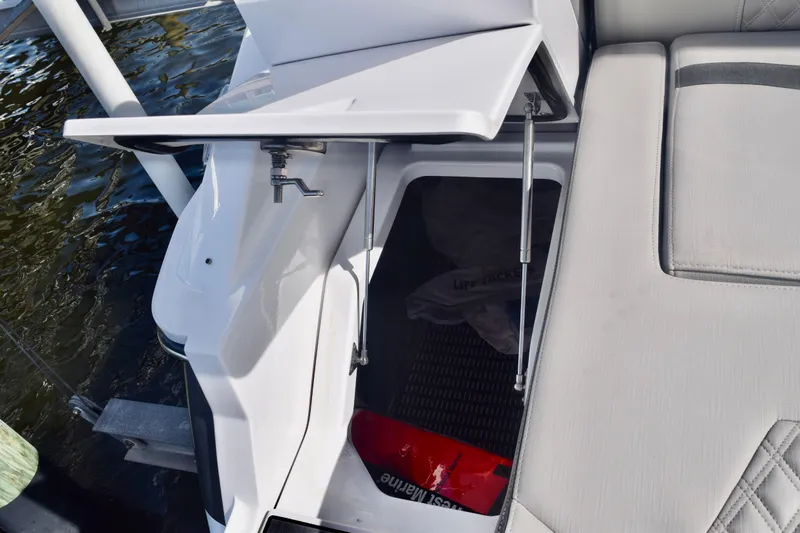  Yacht Photos Pics 2025 Monterey 275SS Super Sport boat storage compartment with open hatch.