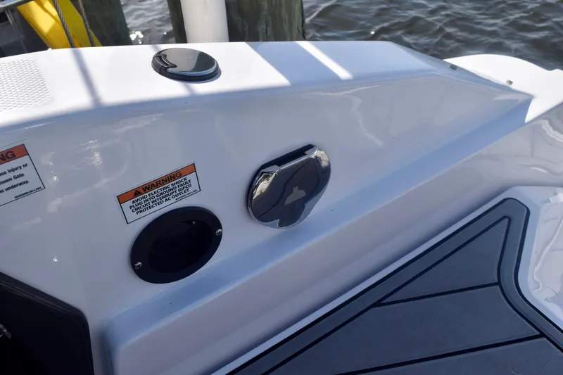  Yacht Photos Pics 2025 Monterey 275SS Super Sport boat deck with warning labels and fittings.