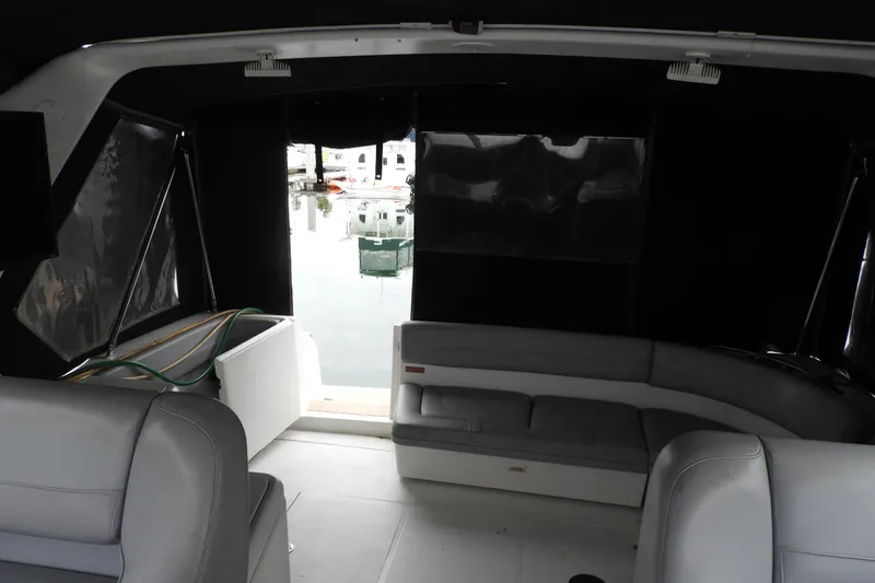  Yacht Photos Pics Interior view of 2005 Back Cove 29 boat with seating and marina backdrop.