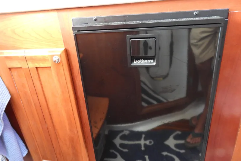  Yacht Photos Pics Isotherm fridge in 2005 Back Cove 29 boat interior, wooden cabinetry.