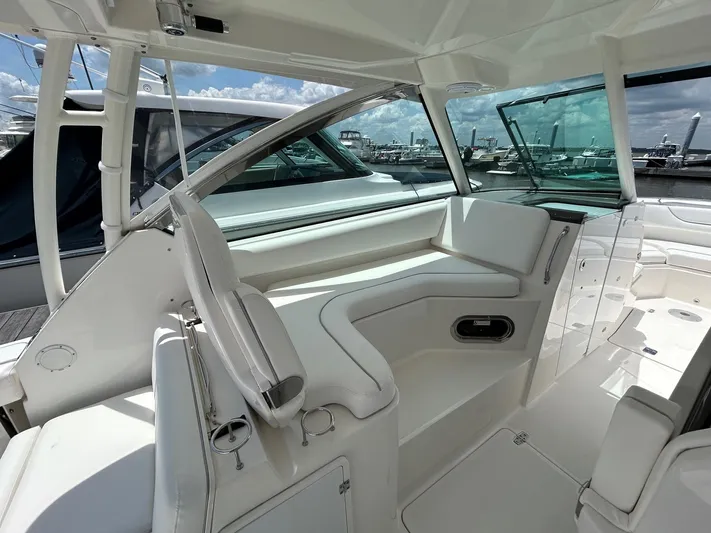  Yacht Photos Pics 2015 Pursuit DC 325 Dual Console boat interior with white seating and open deck view.