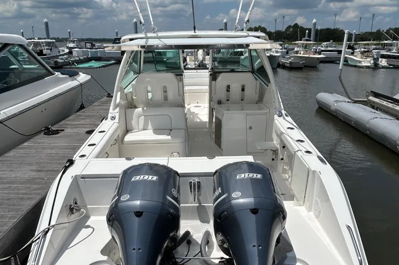  Yacht Photos Pics 2015 Pursuit DC 325 Dual Console boat docked with twin Yamaha engines.