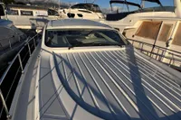 2007 Pershing 50 yacht docked at marina, sleek design, sunny day.