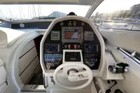 Cockpit of a 2007 Pershing 50 yacht with advanced navigation controls and steering wheel.