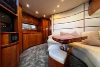 Luxurious interior of a 2007 Pershing 50 yacht with elegant wood finishes.