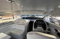 Interior of 2007 Pershing 50 yacht with white seating and modern dashboard.