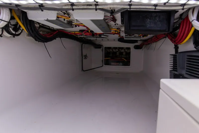  Yacht Photos Pics Interior view of 2021 Bahama 41 Center Console boat wiring and storage compartment.