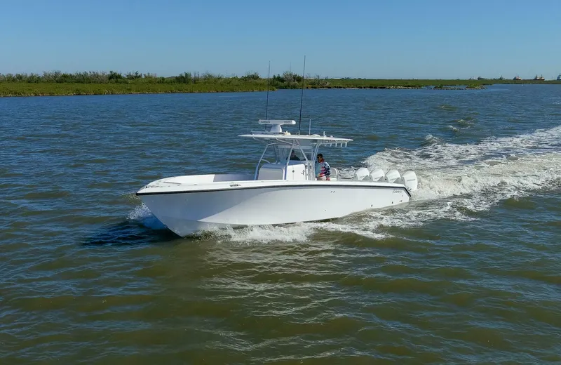  Yacht Photos Pics 2021 Bahama 41 Center Console boat cruising on open water.