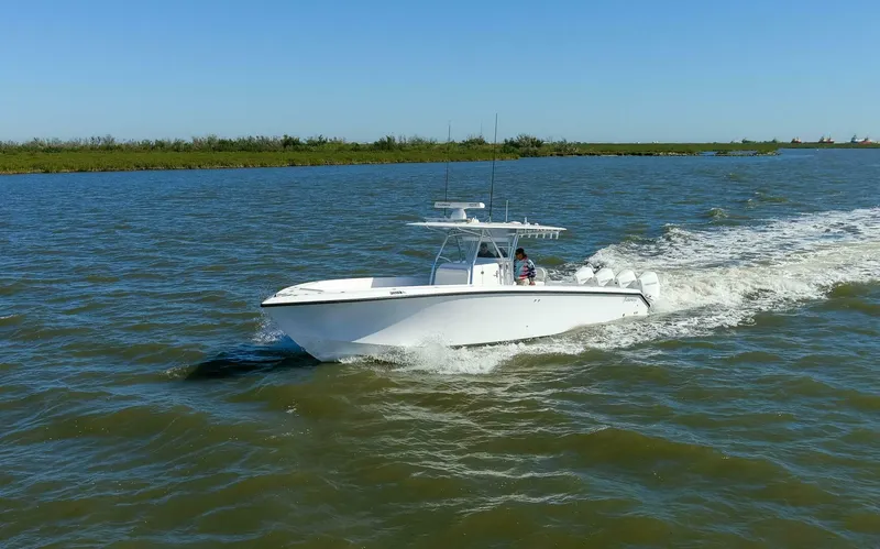  Yacht Photos Pics 2021 Bahama 41 Center Console boat cruising on open water.