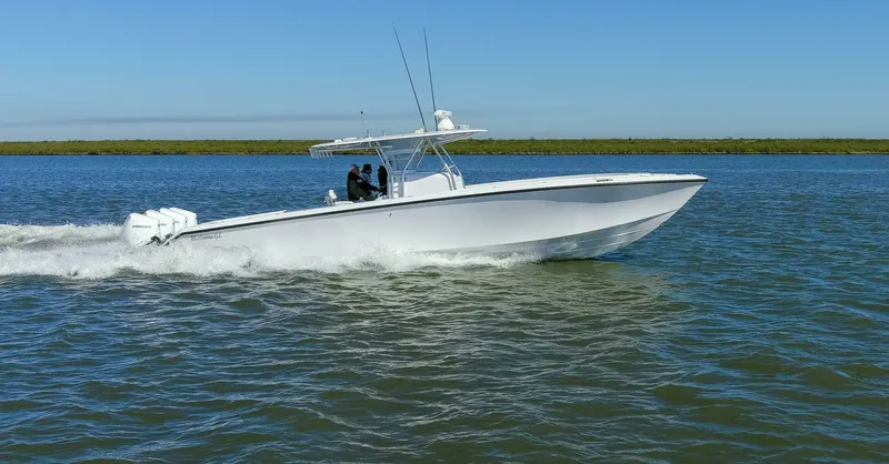  Yacht Photos Pics 2021 Bahama 41 Center Console boat cruising on open water.