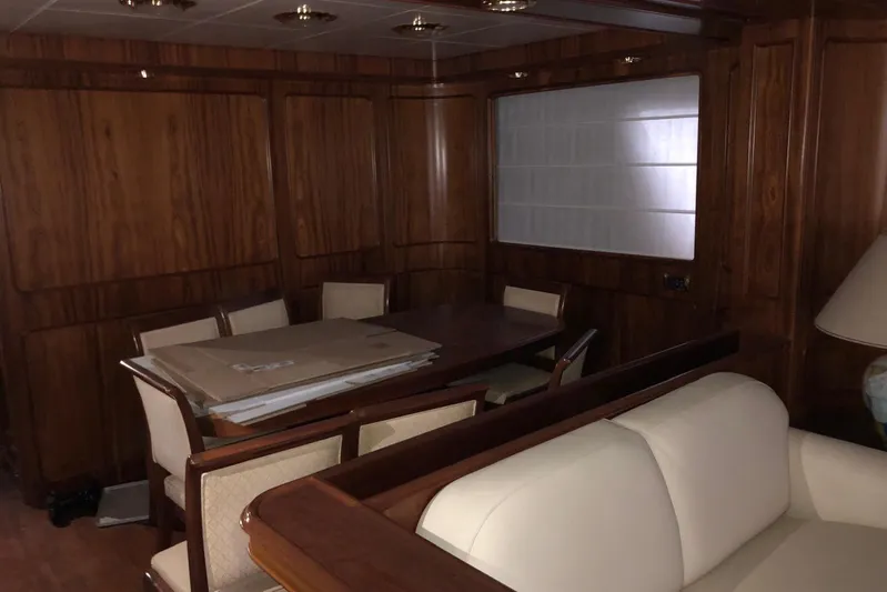  Yacht Photos Pics Luxurious wooden interior of a 1998 Sanlorenzo 82 yacht dining area.