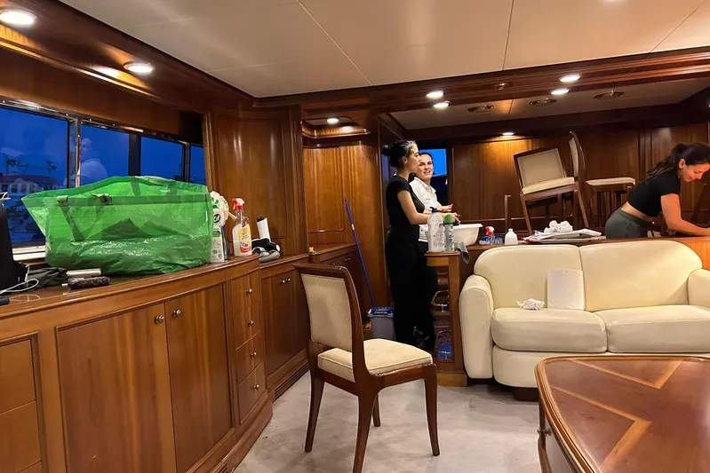  Yacht Photos Pics Interior of 1998 Sanlorenzo 82 yacht with people cleaning and organizing.