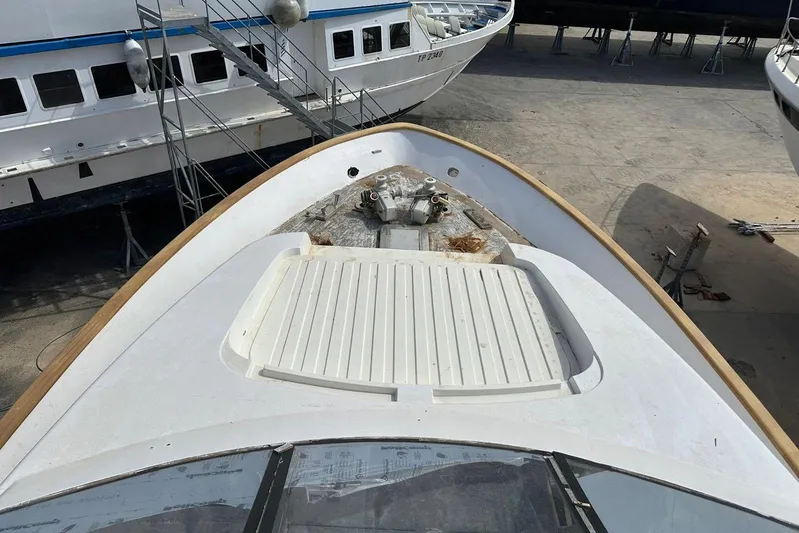  Yacht Photos Pics Bow view of 1998 Sanlorenzo 82 yacht in dry dock, showcasing deck details.