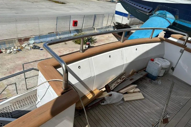  Yacht Photos Pics Deck of a 1998 Sanlorenzo 82 yacht with railing and maintenance supplies.