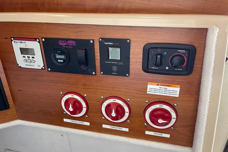  Yacht Photos Pics Control panel of a 2015 Cutwater C-28 boat with various switches and dials.