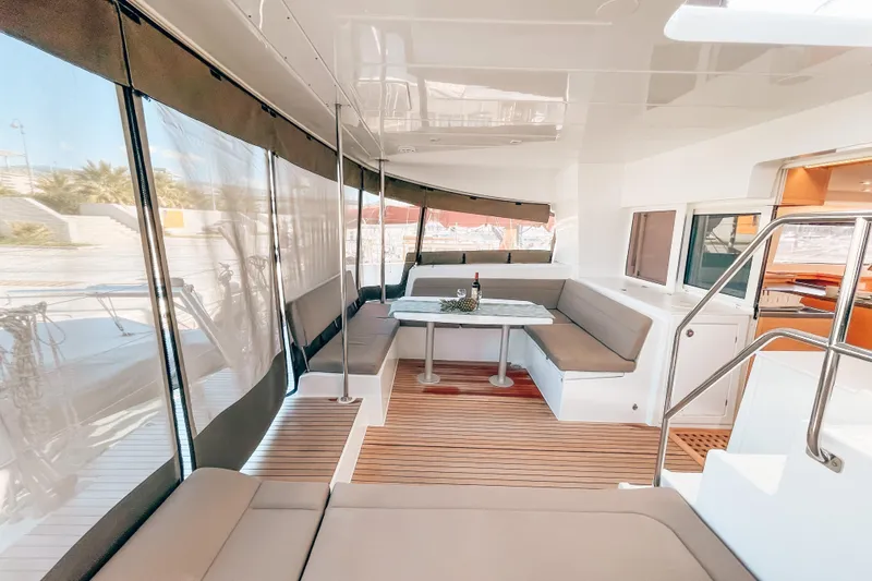  Yacht Photos Pics Luxurious 2019 Lagoon 450S yacht interior with elegant seating and dining area.