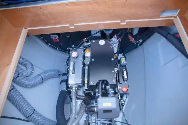  Yacht Photos Pics Engine compartment of 2019 Lagoon 450S yacht, showcasing mechanical components and wiring.