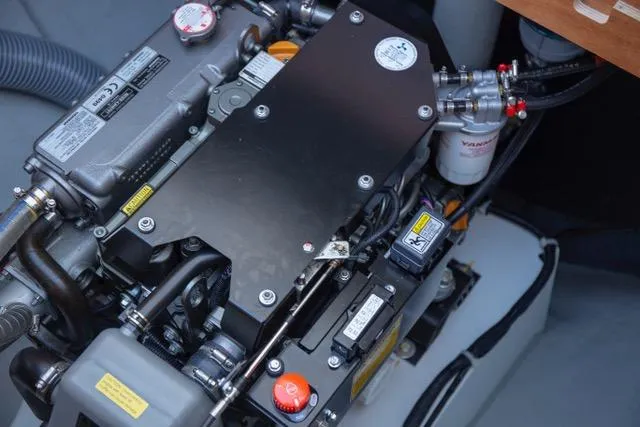  Yacht Photos Pics Engine compartment of a 2019 Lagoon 450S catamaran, showcasing mechanical components.