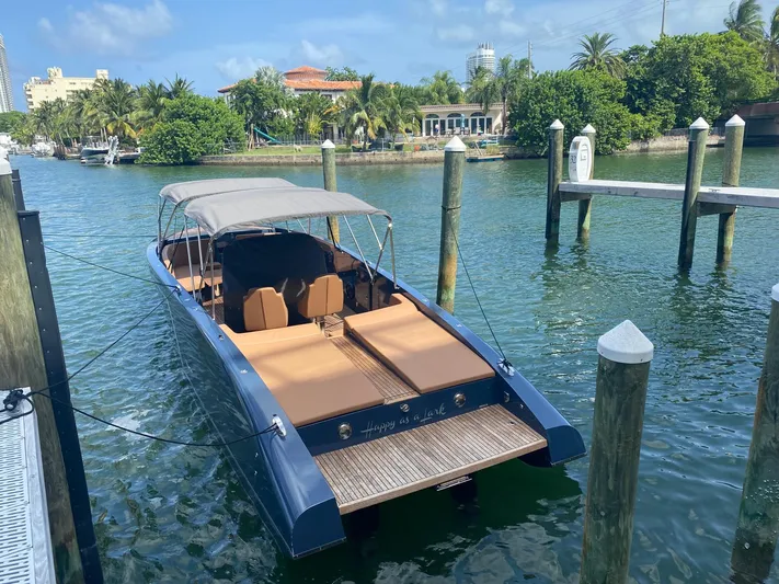  Yacht Photos Pics 2021 Frauscher 1017 GT Air boat docked in a scenic marina setting.