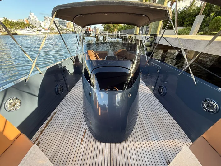  Yacht Photos Pics 2021 Frauscher 1017 GT Air boat docked, featuring sleek design and spacious deck.