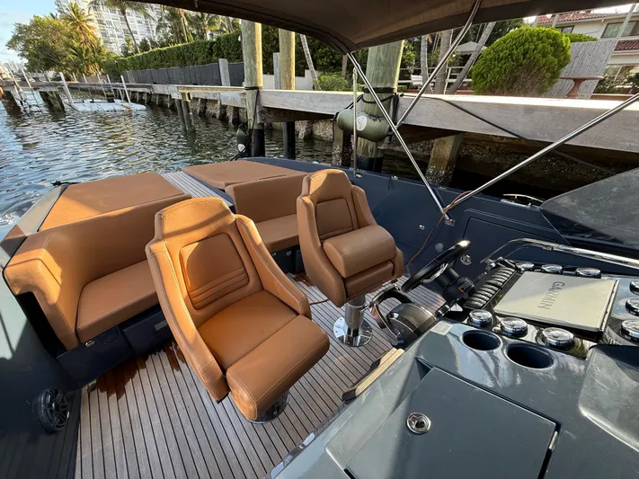  Yacht Photos Pics 2021 Frauscher 1017 GT Air luxury boat interior with tan leather seats and sleek design.