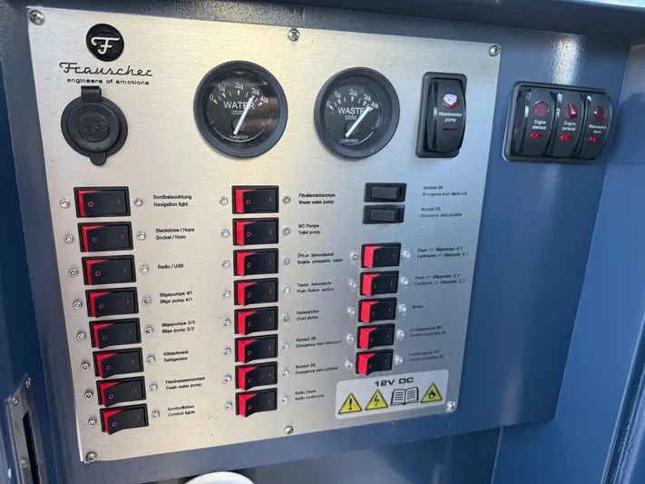  Yacht Photos Pics Control panel of a 2021 Frauscher 1017 GT Air boat with switches and gauges.
