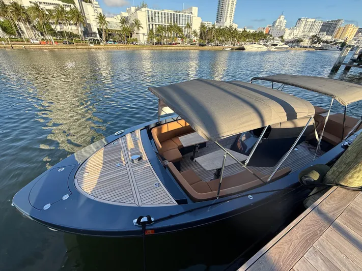 Yacht Photos Pics 2021 Frauscher 1017 GT Air boat docked in a sunny marina setting.