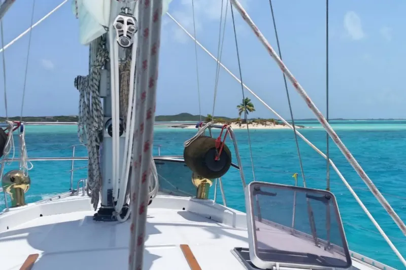 Zephyrus Yacht Photos Pics Beneteau Oceanis 50 sailboat cruising near tropical island with turquoise waters, 1991 model.