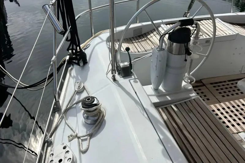 Zephyrus Yacht Photos Pics Cockpit of 1991 Beneteau Oceanis 50 sailboat with steering wheel and winch.