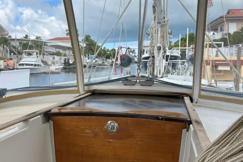 Zephyrus Yacht Photos Pics Cockpit view from a 1991 Beneteau Oceanis 50 sailboat docked in a marina.