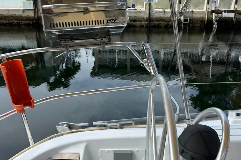 Zephyrus Yacht Photos Pics Beneteau Oceanis 50 sailboat deck with stainless steel railings and a mounted grill, 1991 model.