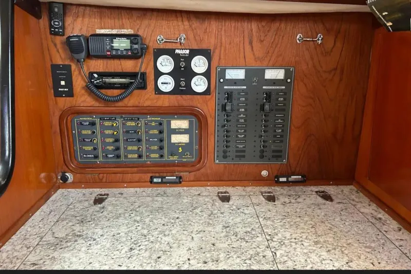 Zephyrus Yacht Photos Pics Control panel of a 1991 Beneteau Oceanis 50 sailboat with navigation equipment.