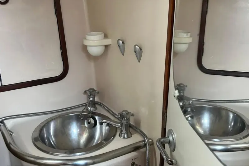 Zephyrus Yacht Photos Pics Bathroom sink area on a 1991 Beneteau Oceanis 50 yacht.