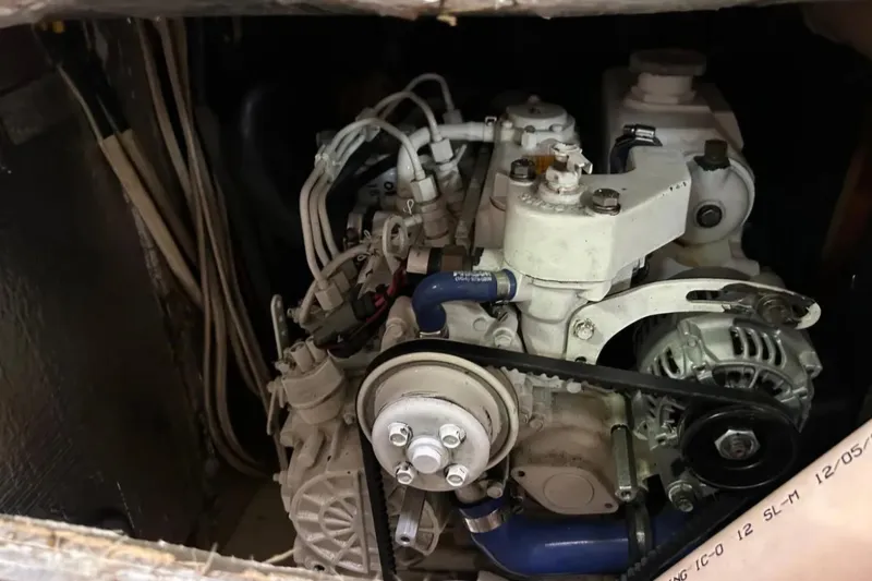 Zephyrus Yacht Photos Pics Engine compartment of a 1991 Beneteau Oceanis 50 sailboat, showcasing mechanical components.