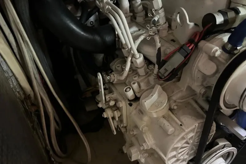 Zephyrus Yacht Photos Pics Engine compartment of a 1991 Beneteau Oceanis 50 sailboat, showing mechanical components.