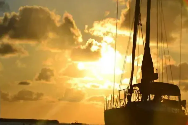 Zephyrus Yacht Photos Pics Sailboat silhouette at sunset, Beneteau Oceanis 50, 1991 model.